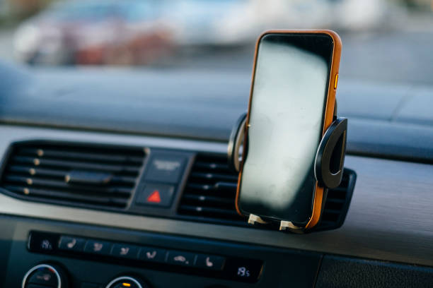 Authentic smartphone mockup installed on a car dashboard