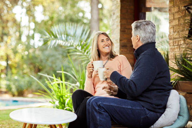 istock Senior couple having coffee in backyard 1317955486