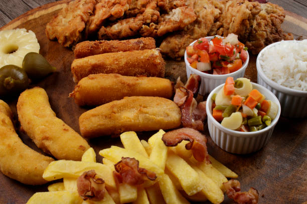 istock Cuban filet. Made with breaded Steak, cheese, breaded ham and banana, Vinaigrette, white rice, pineapple and Fig. Gastronomy photo of dishes. 1317955634