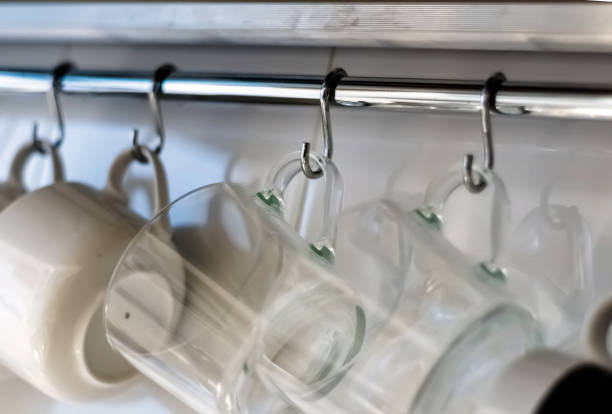 istock A set of mugs hanging on hooks in a modern home kitchen 1317956944