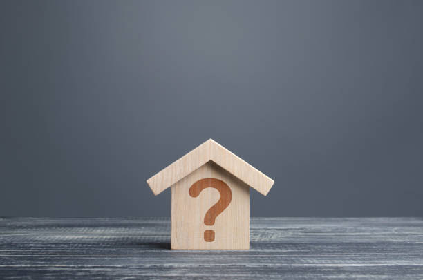 istock House with a question mark. Cost estimate. Solving housing problems, deciding buy or rent real estate. Search for options, choice type of residential buildings. Property price valuation evaluation 1317957578