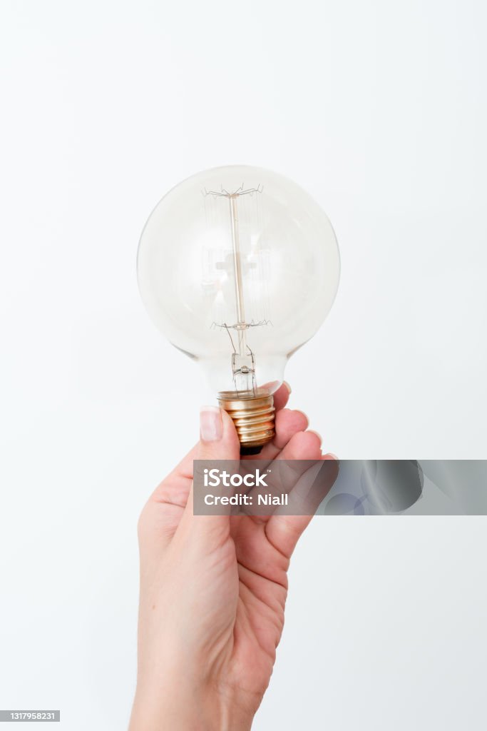 Woman Holding Lamp Presenting New Ideas For Project, Man Hand Showing Bulb And New Technologies, Hand Holding Lighbulb Displaying New Idea Woman Holding Lamp Presenting New Ideas For Project, Man Hand Showing Bulb And New Technologies, Hand Holding Lighbulb Displaying New Idea. Adult Stock Photo