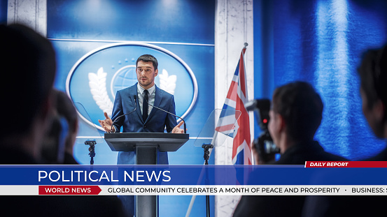 Young Organization Representative Speaking at Press Conference in Government Building. Press Officer Delivering a Speech at Summit. Minister Speaking to Congress. World Political News.