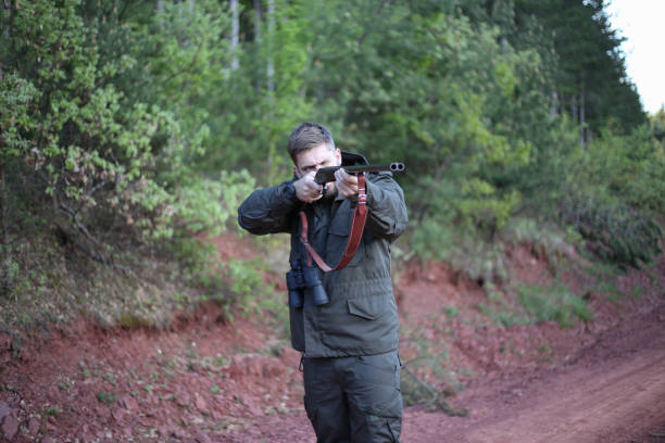 istock Man holding gun stock photo 1317963264