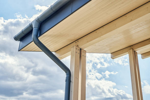 istock Rainwater downpipe installed on building roof with terrace 1317963496