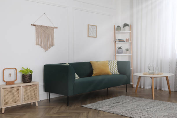 istock Stylish living room interior with comfortable sofa and small table 1317964246