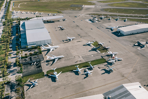 Corporate jet center with a variety of small jets. SJC, San Jose, California, USA.