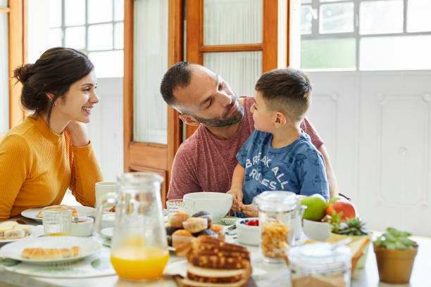 istock Family enjoying breakfast in kitchen 1317965059