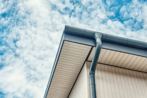 istock Rainwater downpipe installed on roof of new building 1317965123