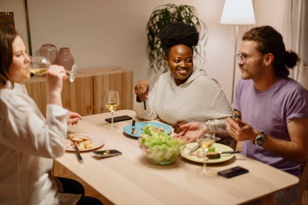 istock Group of young friends having a dinner together 1317965135