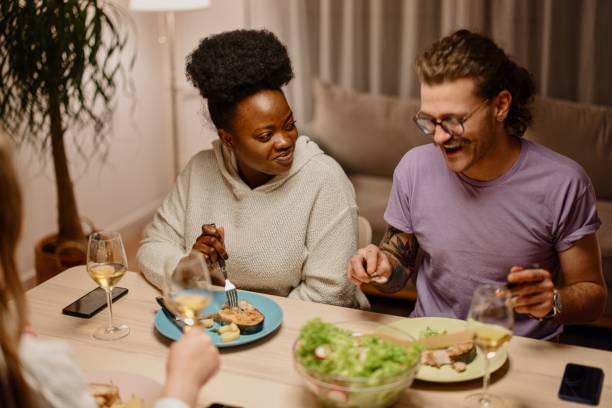 istock Group of young friends having a dinner together 1317965176