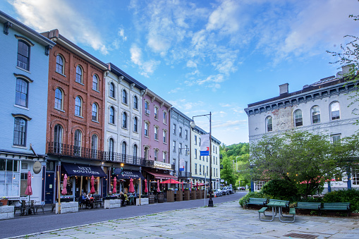 Kingston, NY - USA- May 12, 2021: a landscape view of the shops and restaurants on West Strand Street in The Rondout, Kingston\