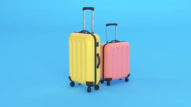 istock Two suitcases, yellow and pink on a blue background. Copy space for text. 3d render. 1317967878