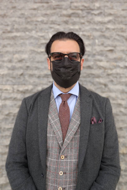 istock Man with black protective facial mask 1317972877