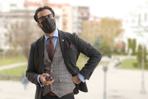 istock Man with black protective facial mask 1317972925