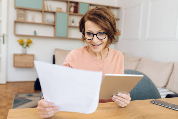 istock Mature female financial advisor working as a freelancer from home 1317973001