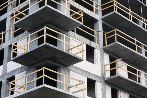 istock Luxurious apartments for sale. Bricks and concrete. Construction site background. High block of flats living area. 1317973836