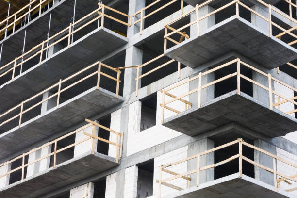 istock Luxurious apartments for sale. Bricks and concrete. Construction site background. High block of flats living area. 1317973885