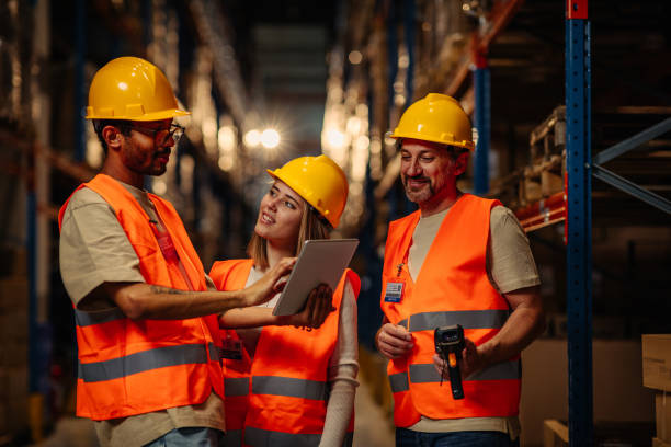 istock Businesspeople discussing about work in warehouse 1317976530