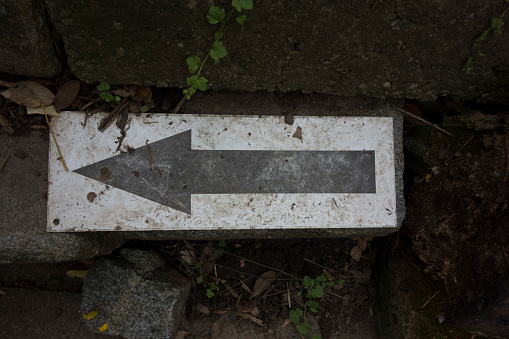 Toilet symbol with icon sign plate on the brick wall structure. Sign and symbol object photo.