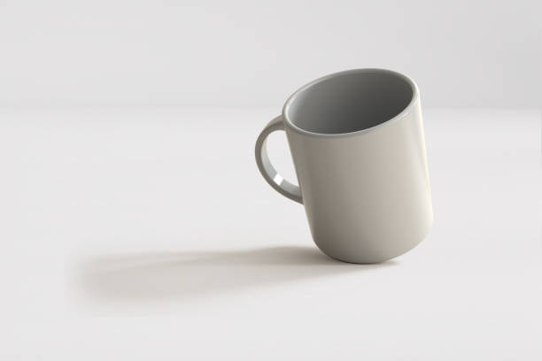 Mockup of a coffee cup or mug, white, isolated, on a plain background, ready to overlay designs or logos for merchandising