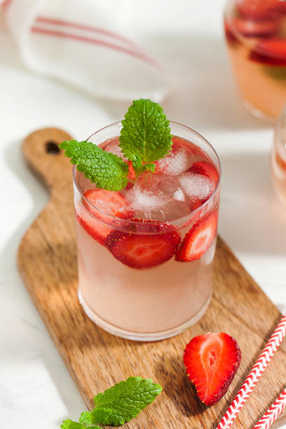 istock A refreshing summer drink with strawberries, lime and mint in a glass. Ice-cold summer lemonade. 1317978145