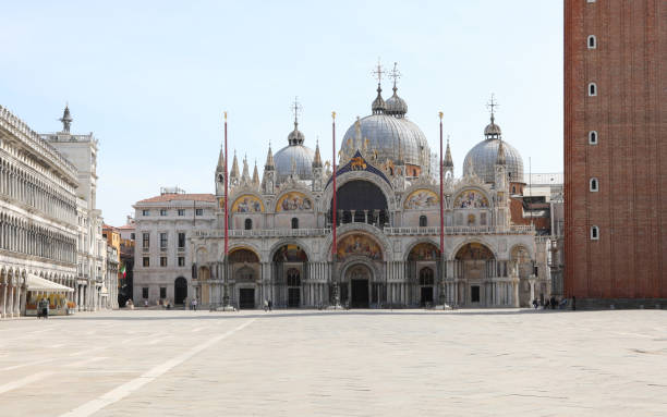 istock Saint Mark Square also called Piazza San Marco in Venice with very few people during the lockdown 1317980421