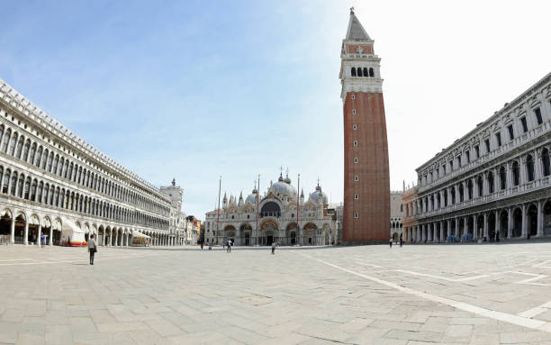 istock Piazza San Marco also called Saint Mark Square in Venice with the Basilica and the high bell tower with very few people during the lockdown 1317980430
