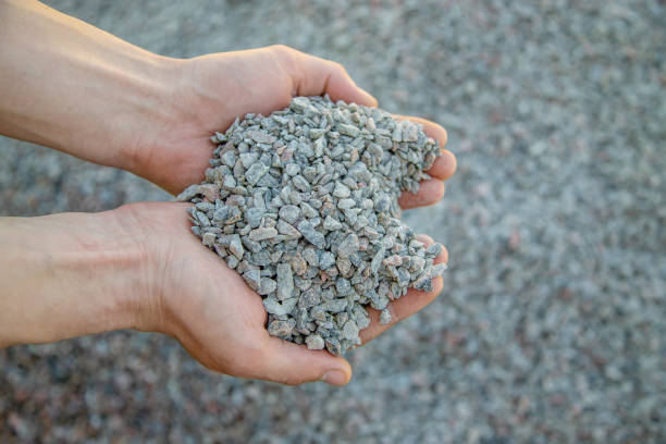 istock Man holding small rubble in his hands selective focus 1317981632
