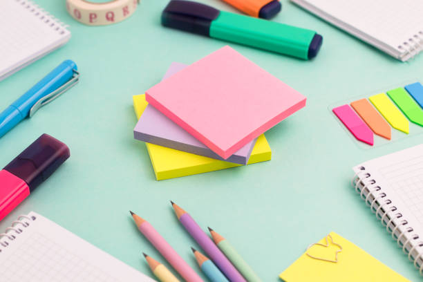 istock Stationeries and office supplies on turquoise background. 1317985703