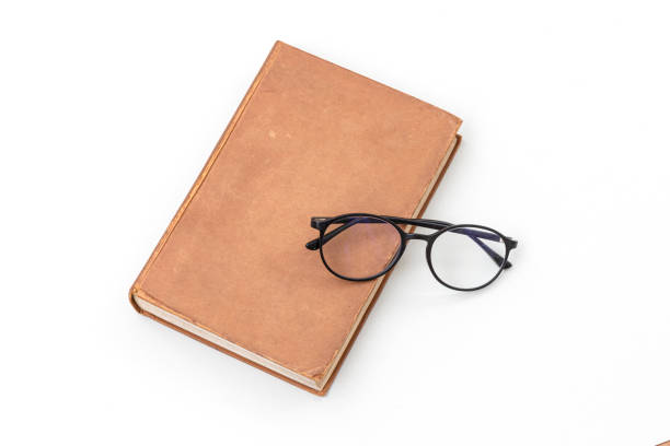 istock Old books with eye-glasses. 1317989679