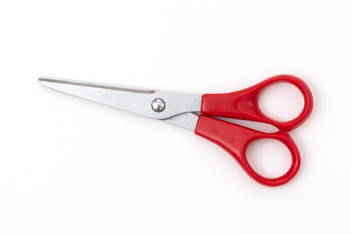 Red kitchen scissors isolated on white background. Clipping Path.