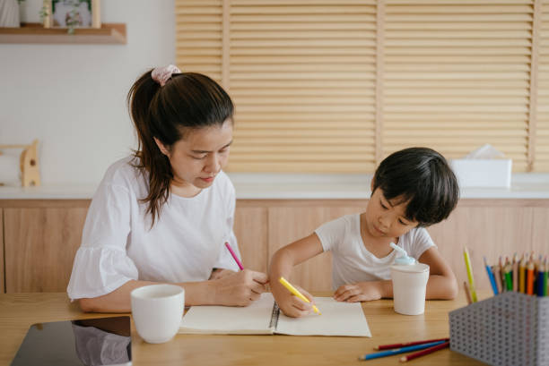 istock Child homeschool with mother 1317994398