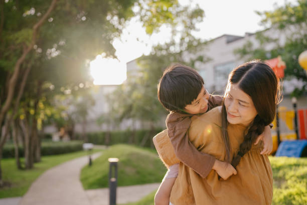 istock Child playing with mother in garden 1317994505