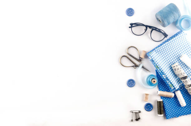 istock Sewing accessories and fabric on a white background. 1317994711