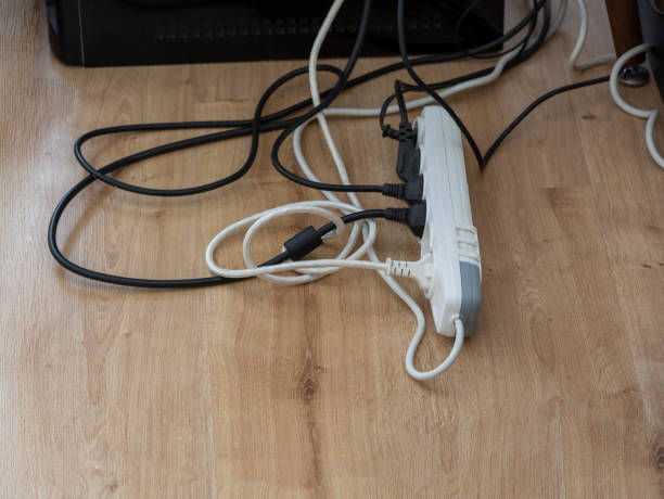 istock Sockets and cables standing on parquet floors. 1317994845