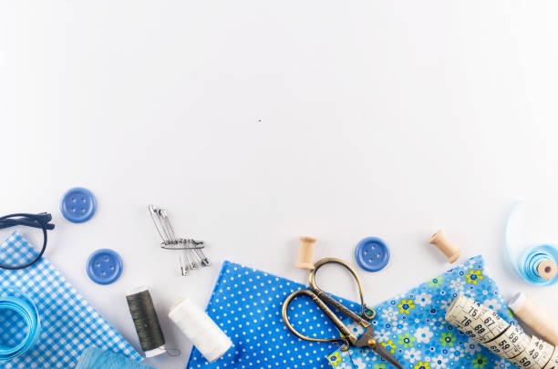 istock Sewing accessories and fabric on a white background. 1317995490