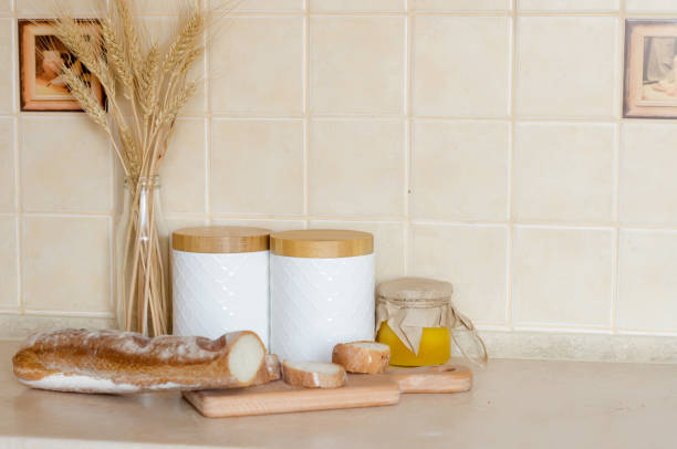 istock Healthy breakfast with baguette, tomatoes, on wooden board. 1317995522