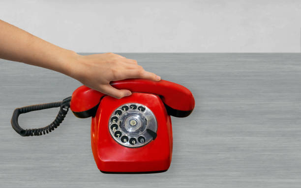 istock holding a red phone 1317995851