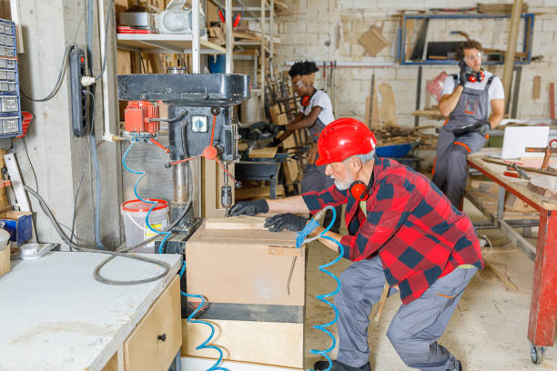 istock Multi-Ethnic Group of Carpenters is Working in a Spacious Manufacture Workshop. 1317996778