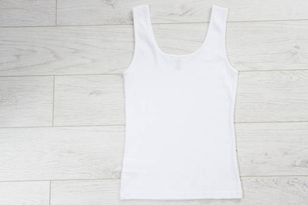 White tank top back view tshirt template mock up on white wooden background top view.