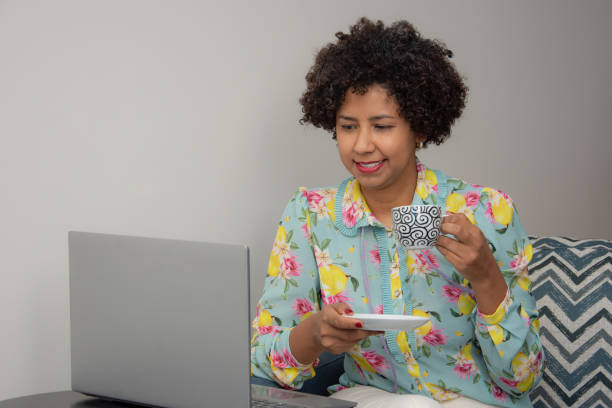 istock woman using cellphone at home office 1317997361