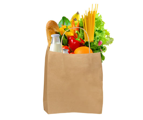 istock Paper bag full of different groceries on white background 1317998228