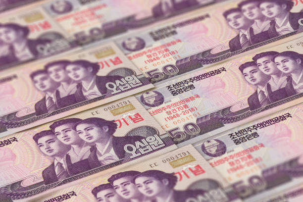 kpw. fondo de billetes de corea del norte. dinero de la rpdc - kim jong il fotografías e imágenes de stock