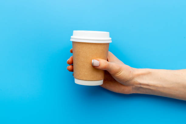 istock Paper cup with coffee in hand. Coffee take away concept 1318006983