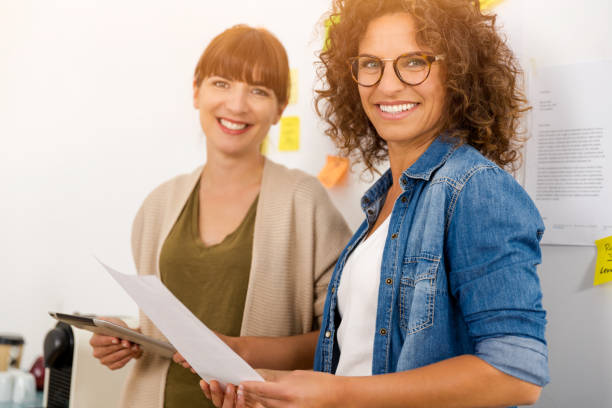 istock Two businesswoman working together 1318008162
