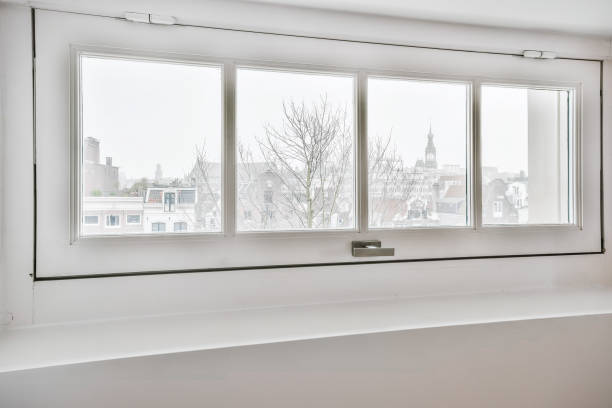 istock Winter cityscape seen through window 1318011619