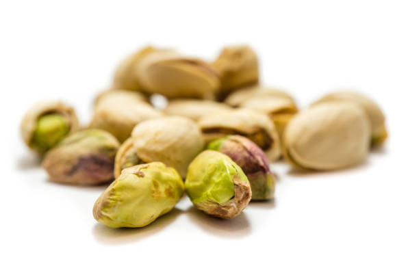 istock Pistachio nuts isolated on white background 1318014043