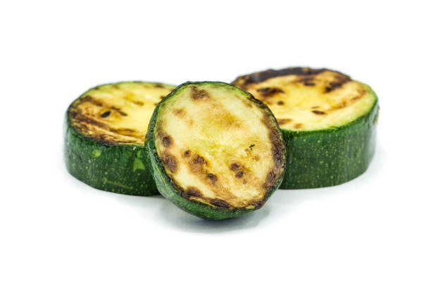 istock Grilled zucchini isolated on white background 1318014044