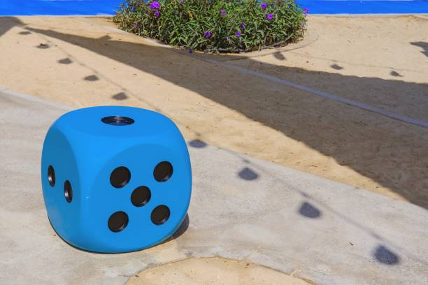 Blue huge gambling cube as a creative decision for urban furniture.